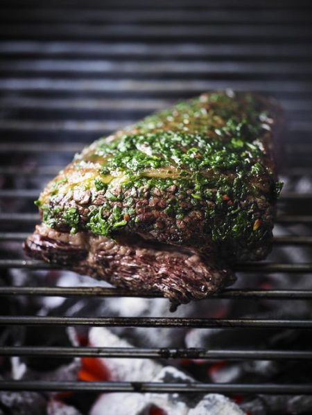 Whole grilled flank Steak with wild garlic chimichurri